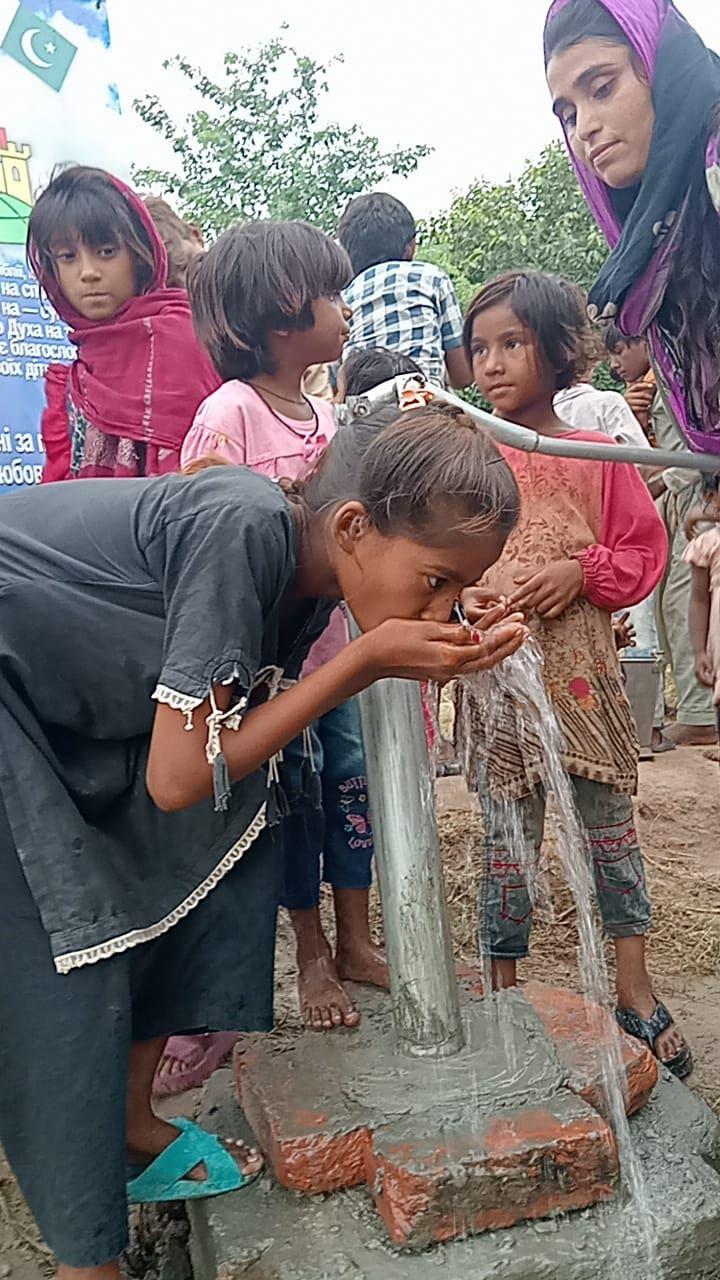 Children at water pump